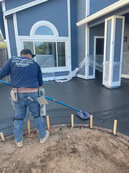 Cruz Landscaping and Design crew finishing a concrete pour